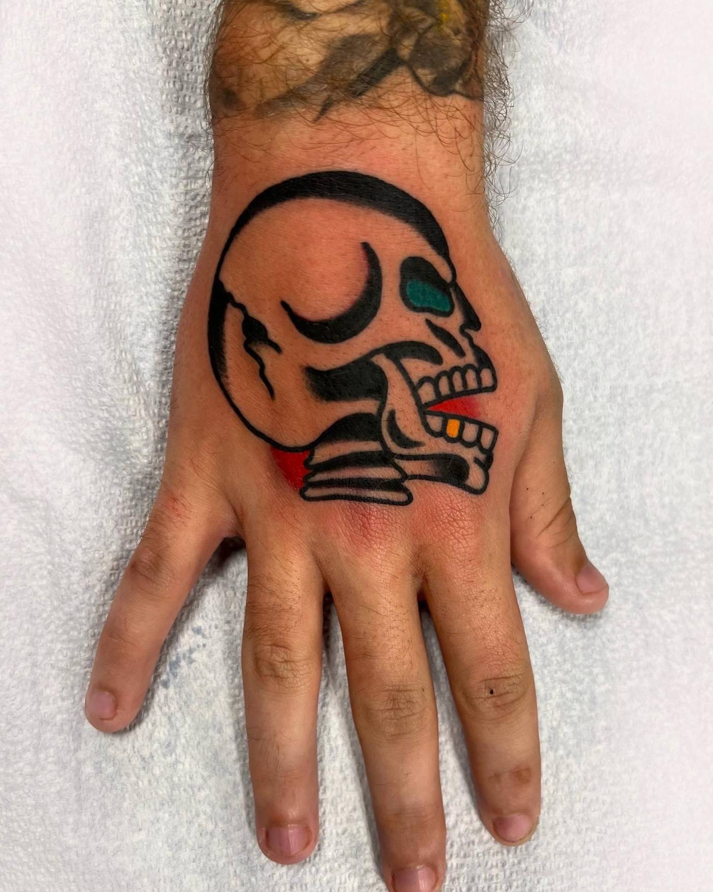 Work by Nick Mella on hand